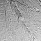 Illustration for article titled We Still Don't Understand These Spots on Saturn's Moon, and We're Not Going Back